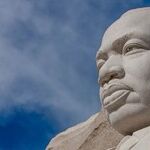 Why Martin Luther King Couldn't Get a Carry Permit: Several Groups Urging the Supreme Court to Overturn New York's Virtual Ban on Bearing Arms Emphasize the Policy's Racist Roots and Impact